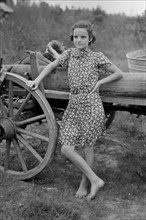 Farm Girl Leaning on Wagon, near Morganza, Louisiana, USA, Russell Lee, November 1938