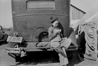 Migrant Girl Sitting on Back of Car, Westlaco, Texas, USA, Russell Lee, February 1939