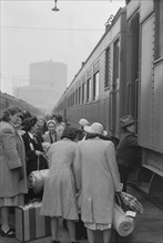 Japanese-Americans Boarding Train During Evacuation of Japanese-Americans from West Coast Areas under U.S. Army War Emergency Order, Los Angeles, California, USA, Russell Lee, April 1942