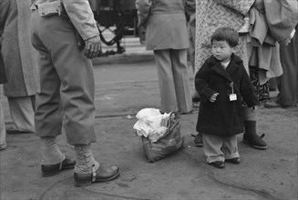 Japanese-American Child During Evacuation of Japanese-Americans from West Coast Areas under U.S. Army War Emergency Order, Los Angeles, California, USA, Russell Lee, April 1942