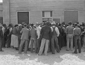 Migrant Workers Waiting for Relief Checks, Calipatria, California, USA, Dorothea Lange for Farm Security Administration, February 1937