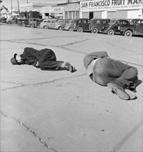 Two Men Sleeping on Sidewalk of "Skid Row", Howard Street, San Francisco, California, USA, Dorothea Lange for Farm Security Administration, February 1937