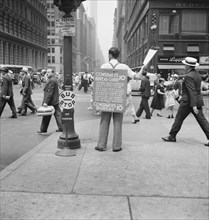 Street Hawker Selling Consumer's Bureau Guide, 42nd Street and Madison Avenue, New York City, New York, USA, Dorothea Lange for Farm Security Administration, July 1939