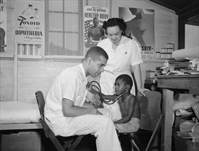 Medical Clinic at Farm Security Administrations (FSA) Agricultural Workers' Camp, Bridgeton, New Jersey, USA, John Collier for Farm Security Administration, July 1942
