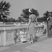 Woman Holding Harness Strap to Prevent Child from Getting Lost at Park, Detroit, Michigan, USA, Arthur S. Siegel for Office of War Information, July 1942