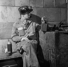 Miner Having Lunch in Machine Shop, Montour No. 4 Mine of Pittsburgh Coal Company, Pittsburgh, Pennsylvania, USA, John Collier for Office of War Information, November 1942