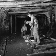Three Miners Laying Track in Montour No. 4 Mine of Pittsburgh Coal Company, Pittsburgh, Pennsylvania, USA, John Collier for Office of War Information, November 1942