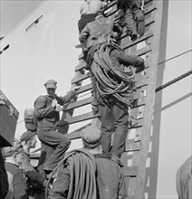 Workers on Ladder at Outfitting Pier, Bethlehem-Fairfield Shipyards, Baltimore, Maryland, USA, Arthur S. Siegel for Office of War Information, May 1943