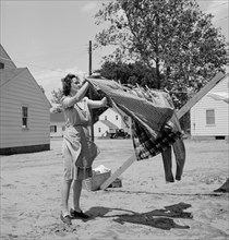 Woman Hanging Clothes on the Line, Point Pleasant, West Virginia, USA, Arthur S. Siegel for Office of War Information, May 1943