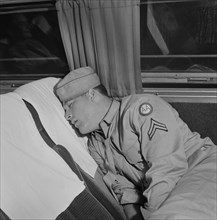 Soldier Sleeping on Greyhound Bus, Cincinnati, Ohio, USA, Esther Bubley for Office of War Information, September 1943