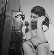 Woman Using Telephone in Boardinghouse, Washington DC, USA, Esther Bubley for Office of War Information, January 1943