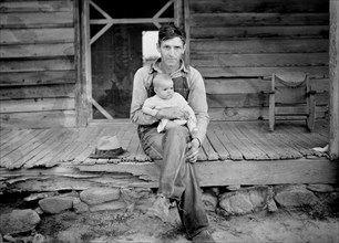 Tobacco Sharecropper with Baby on Front Porch, Person County, North Carolina, USA, Dorothea Lange for Farm Security Administration, July 1939