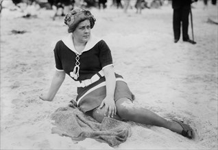 Woman Sitting on Beach, Long Beach, New York, USA, Bain News Service, circa 1910