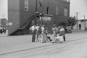 Group of Men Hanging out Near Railroad Tracks in Center of Town, Fitzgerald, Georgia, USA, Marion Post Wolcott for Farm Security Administration, March 1939