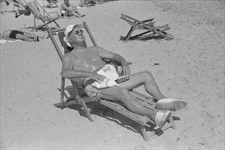 Man Sunbathing on Beach, Miami Beach, Florida, USA, Marion Post Wolcott for Farm Security Administration, March 1939