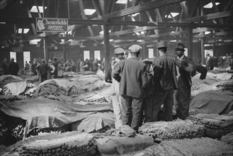 Farmers Waiting for Tobacco to be Sold at Auction in Warehouse, Durham, North Carolina, USA, Marion Post Wolcott for Farm Security Administration, November 1939