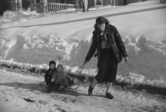 Woman Pulling Two Children on Sled in Winter, Woodstock, Vermont, USA, Marion Post Wolcott for Farm Security Administration, March 1940