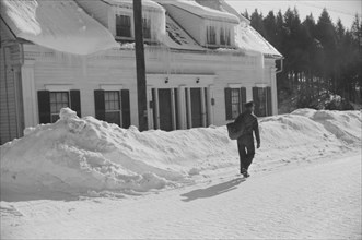 Mailman Delivering Mail after Heavy Snowfall, Rear View, Woodstock, Vermont, USA, Marion Post Wolcott for Farm Security Administration, March 1940