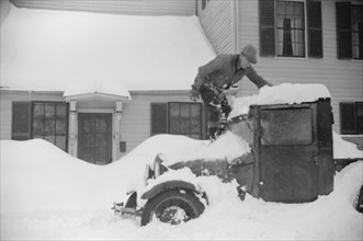 Man Clearing Snow from Truck after Heavy Snowfall, Woodstock, Vermont, USA, Marion Post Wolcott for Farm Security Administration, March 1940