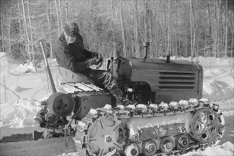 Hauling Timber by Tractor to Road where it is Taken by Truck to Mill, near Barnard, Vermont, USA, Marion Post Wolcott for Farm Security Administration, March 1940