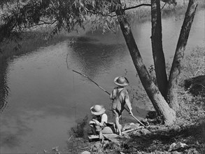 Two Cajun Boys Fishing in Bayou, Schriever, Terrabonne Parish, Louisiana, USA, Marion Post Wolcott for Farm Security Administration, June 1940