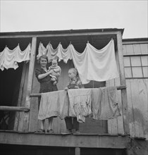 Miner's Wife and Children on Porch, Pursglove, West Virginia, USA, Marion Post Wolcott for Farm Security Administration, September 1938