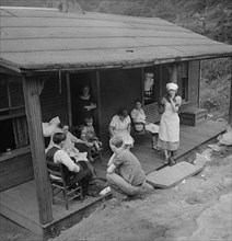 Family of Man Dying of Tuberculosis Gathering on Front Porch of Home, Marine, West Virginia, USA, Marion Post Wolcott for Farm Security Administration, September 1938