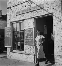 Woman Leaving Employment Agency, Miami, Florida, USA, Marion Post Wolcott for Farm Security Administration, January 1939