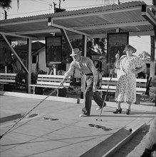Elderly Couple Playing Shuffleboard, Sarasota Trailer Park, Sarasota, Florida, USA, Marion Post Wolcott for Farm Security Administration, January 1941