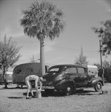 Man Washing Car at Trailer Park, Sarasota, Florida, USA, Marion Post Wolcott for Farm Security Administration, January 1941