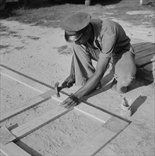 Man Building Home Screen Door, Ridge, Maryland, USA, Marion Post Wolcott for Farm Security Administration, July 1941