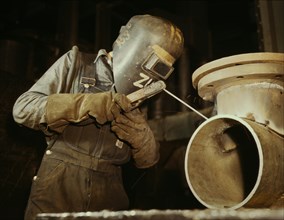 Welder Making Boilers for Ship, Chattanooga, Tennessee, USA, Alfred T. Palmer for Office of War Information, June 1942