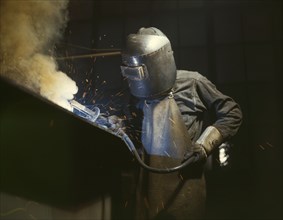 Welder Making Boilers for Ship, Chattanooga, Tennessee, USA, Alfred T. Palmer for Office of War Information, June 1942