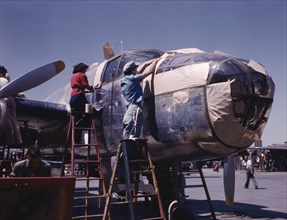 B-25 Bomber Being Prepared for Painting on Outside Assembly Line, North American Aviation Plant, Inglewood, California, USA, Alfred T. Palmer for Office of War Information, October 1942