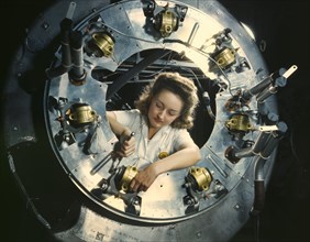 Female Worker Assembling B-25 Bomber Engine, North American Aviation Plant, Inglewood, California, USA, Alfred T. Palmer for Office of War Information, October 1942