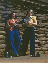 Two Female Factory Workers on Lunch Break, Douglas Aircraft Company, Long Beach, California, USA, Alfred T. Palmer for Office of War Information, October 1942