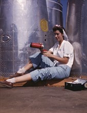 Female Worker Enjoying Sunshine while on Lunch Break, Douglas Aircraft Company, Long Beach, USA, Alfred T. Palmer for Office of War Information, October 1942