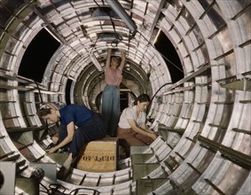 Female Workers Installing Fixtures to Tail Fuselage of B-17F Bomber, Douglas Aircraft Company, Long Beach, California, USA, Alfred T. Palmer for Office of War Information, October 1942
