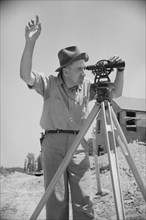 Surveyor Working in Model Community Planned by Suburban Division of U.S. Resettlement Administration, Greenbelt, Maryland, USA, Carl Mydans for U.S. Resettlement Administration, July 1936