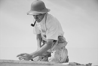 Carpenter Working in Model Community Planned by Suburban Division of U.S. Resettlement Administration, Greenbelt, Maryland, USA, Carl Mydans for U.S. Resettlement Administration, August 1936