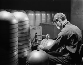 Worker Converting Beverage Containers to Aviation Oxygen Cylinders for High Altitude Flying, Firestone, Akron, Ohio, USA, Alfred T. Palmer for Office of War Information, February 1942