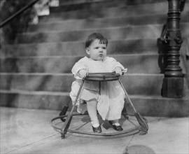 Baby in Walker on Sidewalk, Washington DC, USA, National Photo Company, 1921