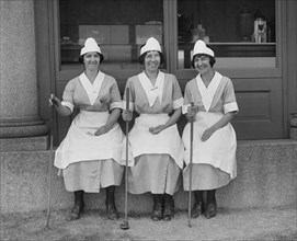 Three Women Wearing Uniforms Holding Golf Clubs, National Photo Company, 1923