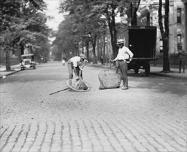 Two Dog Catchers Catching Dog in Street, Washington DC, USA, National Photo Company, July 1924