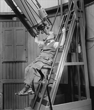Dr. David Todd Looking Through Telescope, Georgetown Observatory, Washington DC, USA, National Photo Company, August 1924