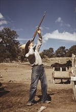 Homesteader Shooting at Hawks, Pie Town, New Mexico, USA, Lee Russell for Farm Security Administration, October 1940