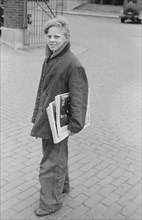 Newspaper Boy around Stockyards, South Omaha, Nebraska, USA, John Vachon for Farm Security Administration, November 1938