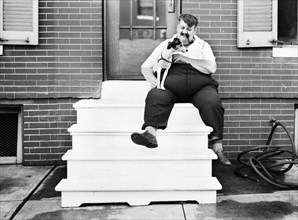 Heavy Man with Dog in front of Row House, Baltimore, Maryland, USA, John Vachon for Office of War Information, July 1938