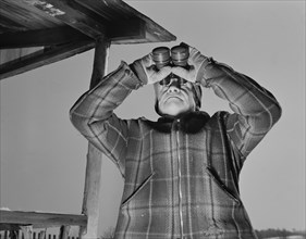 Man Looking Through Binoculars, Airplane Observation Post, Bantam, Connecticut, USA, Howard R. Hollem for Office of Emergency Management, January 1942