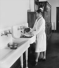Young Woman Washing Dishes, College Home Economics Class, Washington DC, USA, National Photo Company, December 1926
